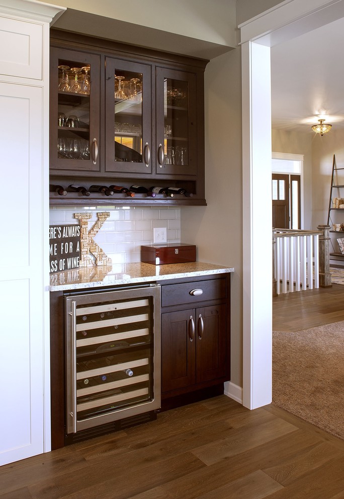 L-shaped kitchen photo with stainless steel appliances and an island