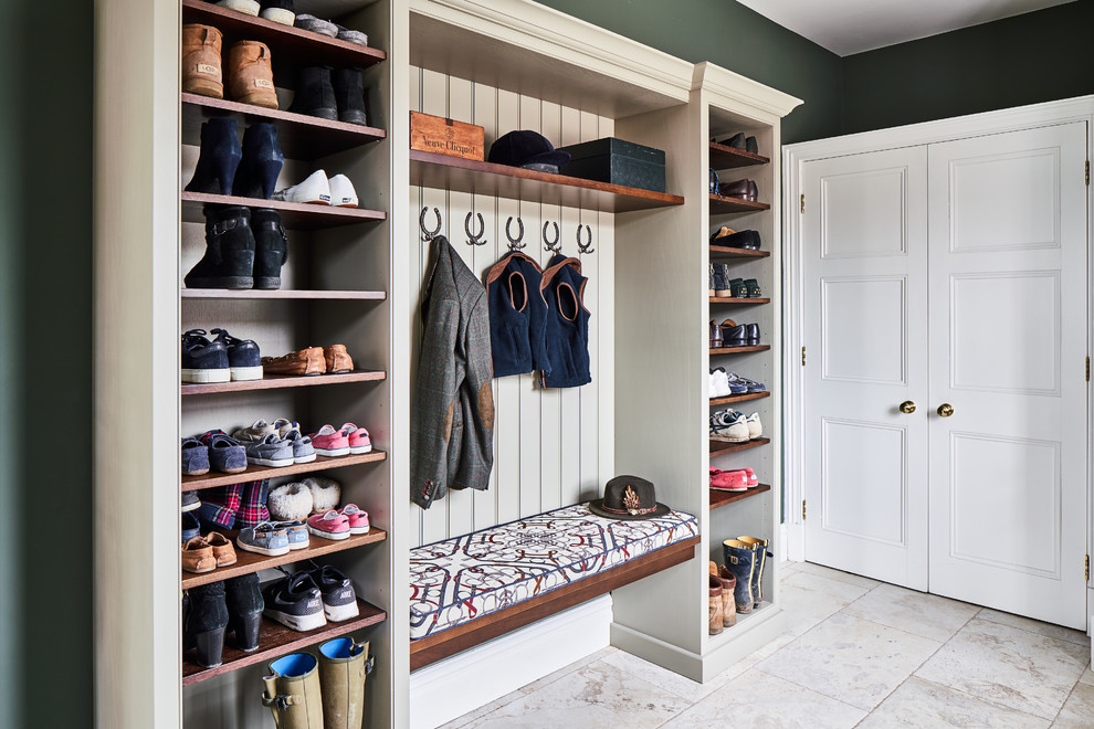 Traditional mudroom in Cheshire with green walls and beige floor.