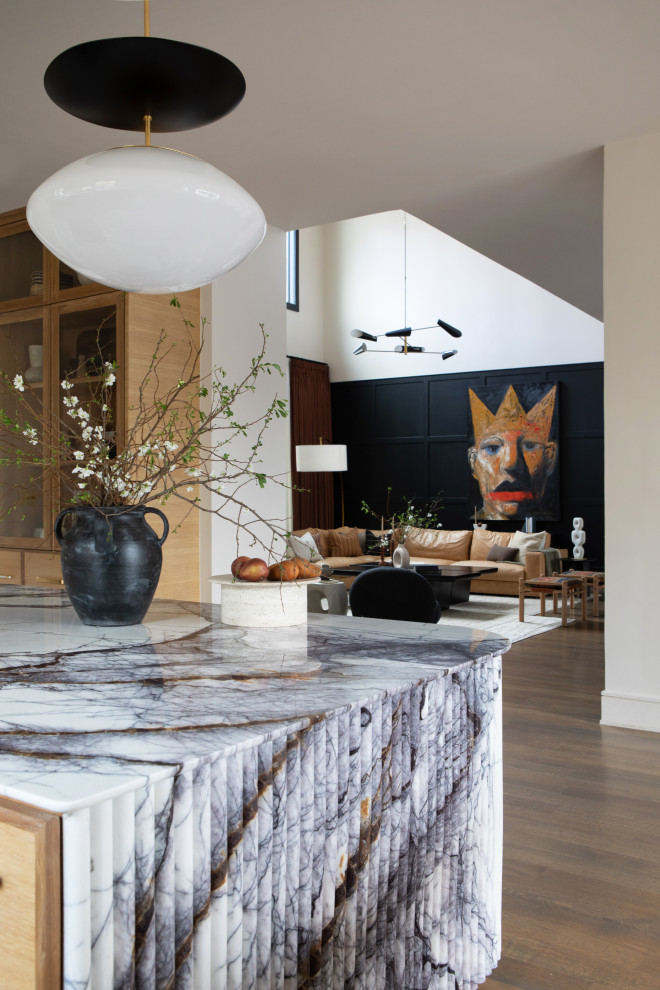Mid-sized trendy u-shaped medium tone wood floor enclosed kitchen photo in Dallas with an undermount sink, flat-panel cabinets, medium tone wood cabinets and an island
