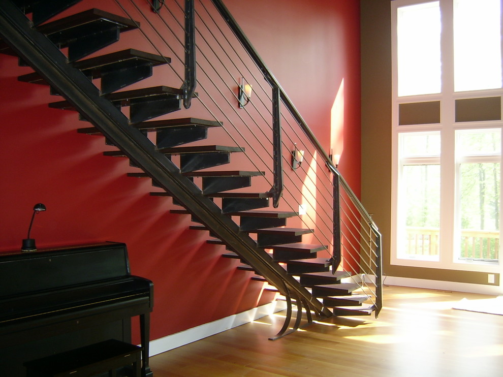 Design ideas for a modern wood floating staircase in Philadelphia with open risers.