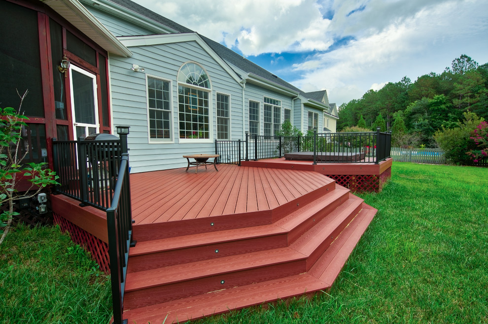 Example of a mid-sized transitional backyard deck design in Richmond with no cover