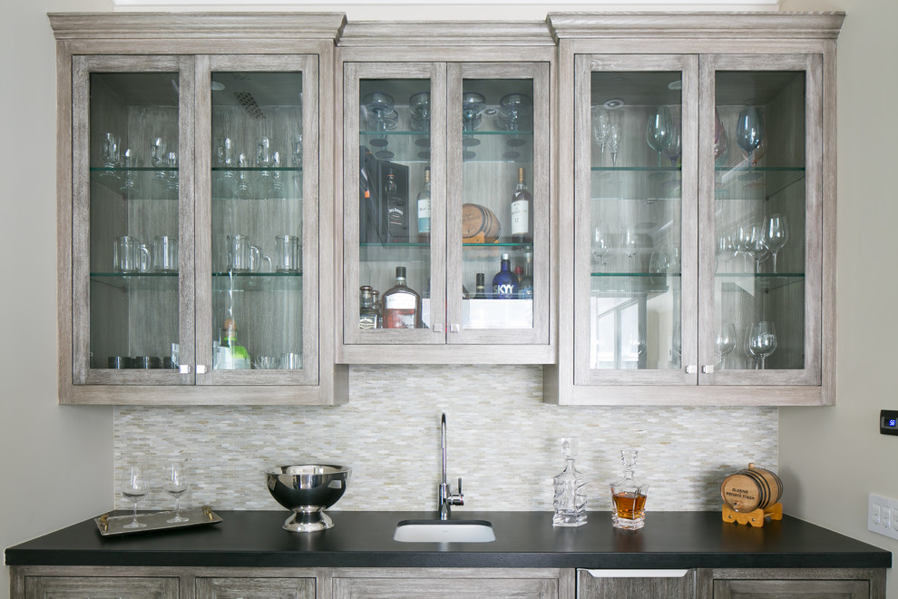 This is an example of a transitional home bar in Orange County.