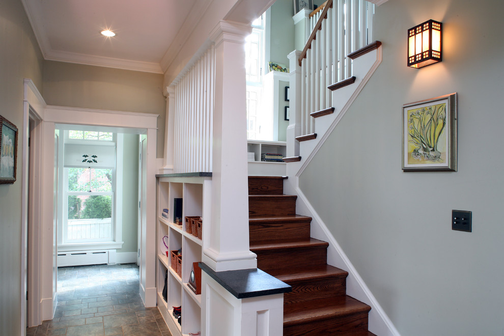 Photo of a mid-sized arts and crafts wood u-shaped staircase in DC Metro with wood risers and wood railing.