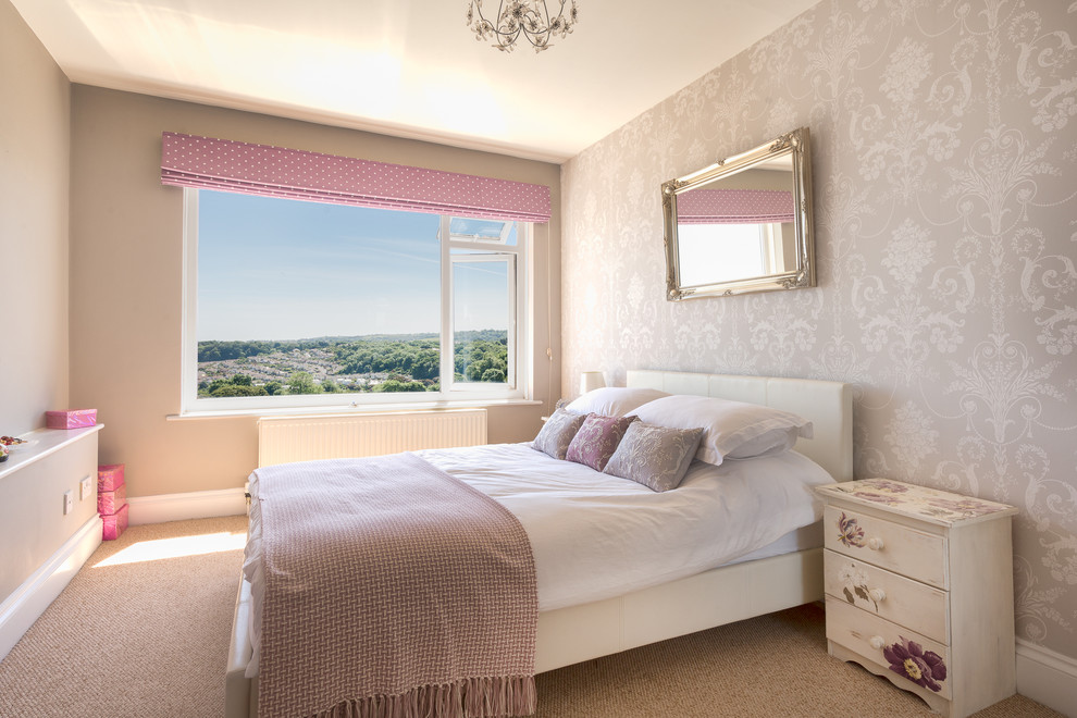 Mid-sized beach style guest bedroom in Devon with grey walls and carpet.