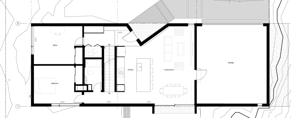 Modern inredning av ett litet svart hus, med två våningar, metallfasad och platt tak