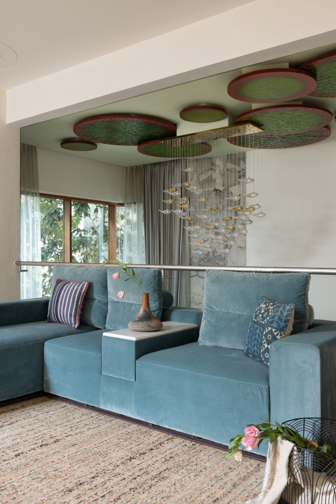 Photo of a contemporary Loft-style living room in Bengaluru With White Walls and Carpet.