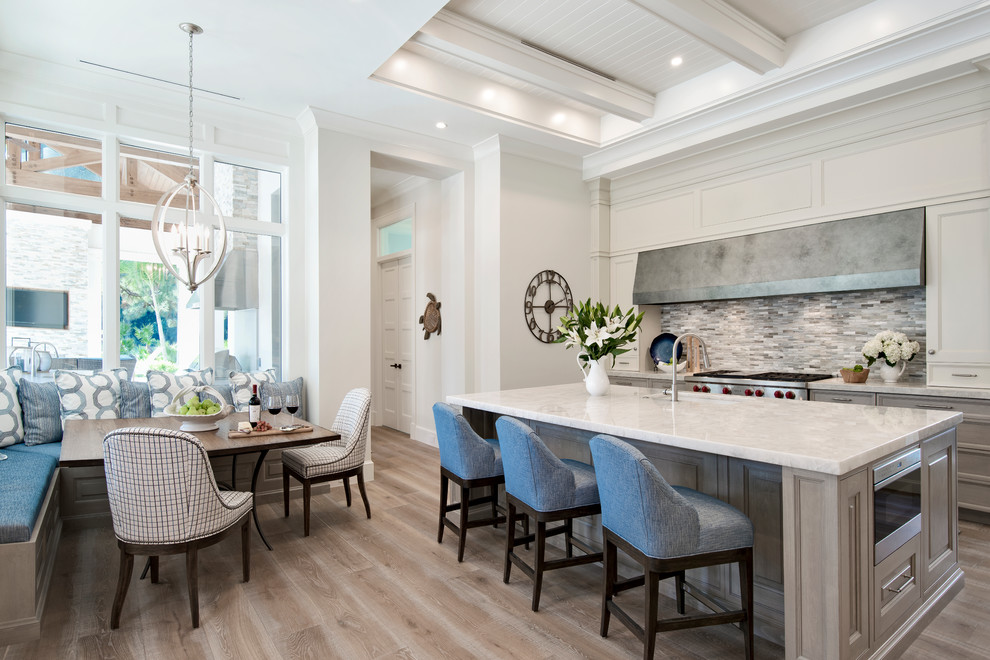 Inspiration for a transitional light wood floor open concept kitchen remodel with stainless steel appliances and an island