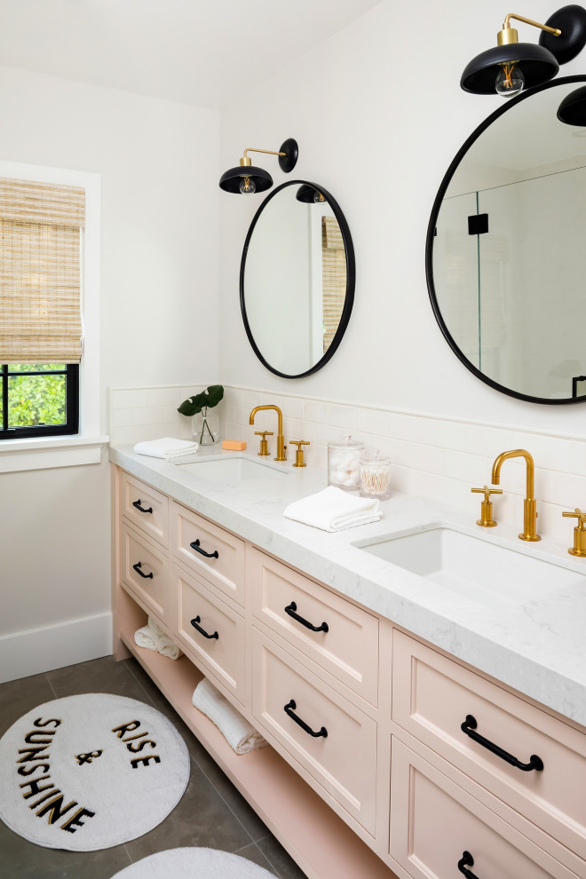 Small country kids bathroom with shaker cabinets, an alcove shower, a two-piece toilet, white tile, subway tile, white walls, limestone floors, an undermount sink, engineered quartz benchtops, green floor, a hinged shower door, white benchtops, a double vanity and a built-in vanity.
