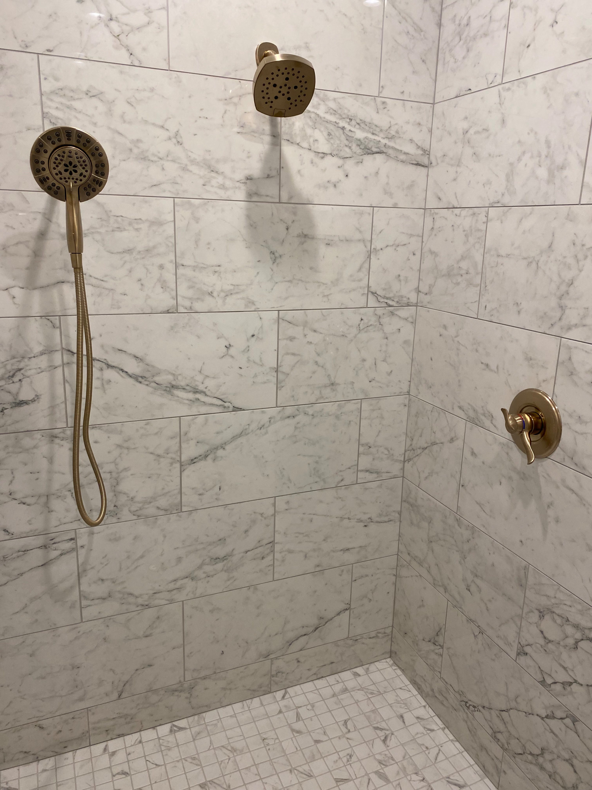 master shower tile and champagne bronze shower accessories