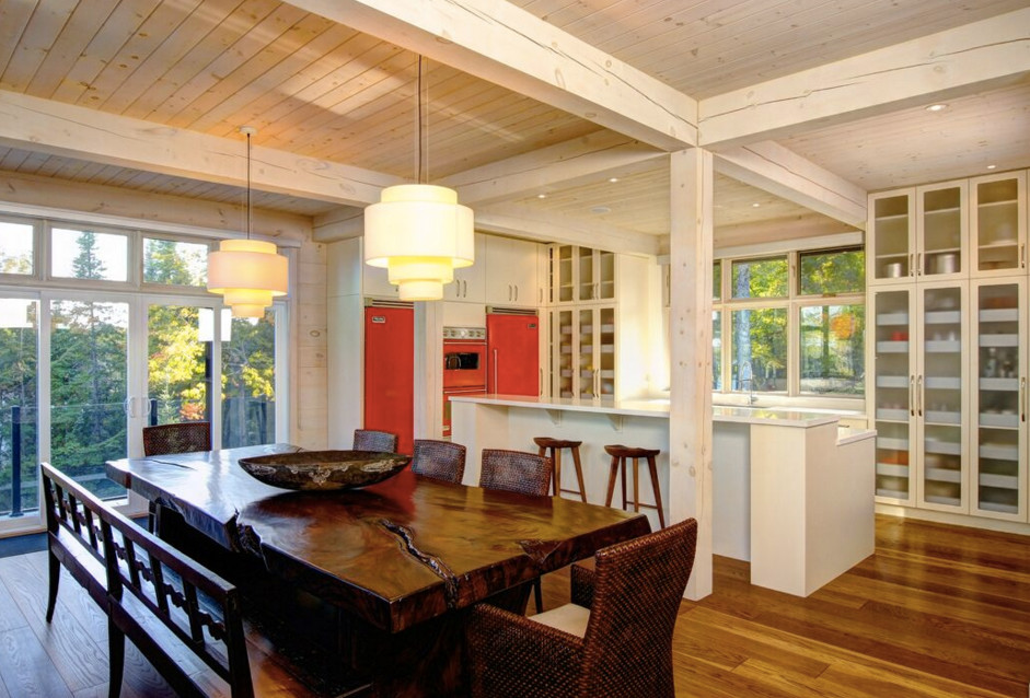 Inspiration for a large rustic galley dark wood floor open concept kitchen remodel in Boston with an undermount sink, shaker cabinets, white cabinets, granite countertops, stainless steel appliances and an island