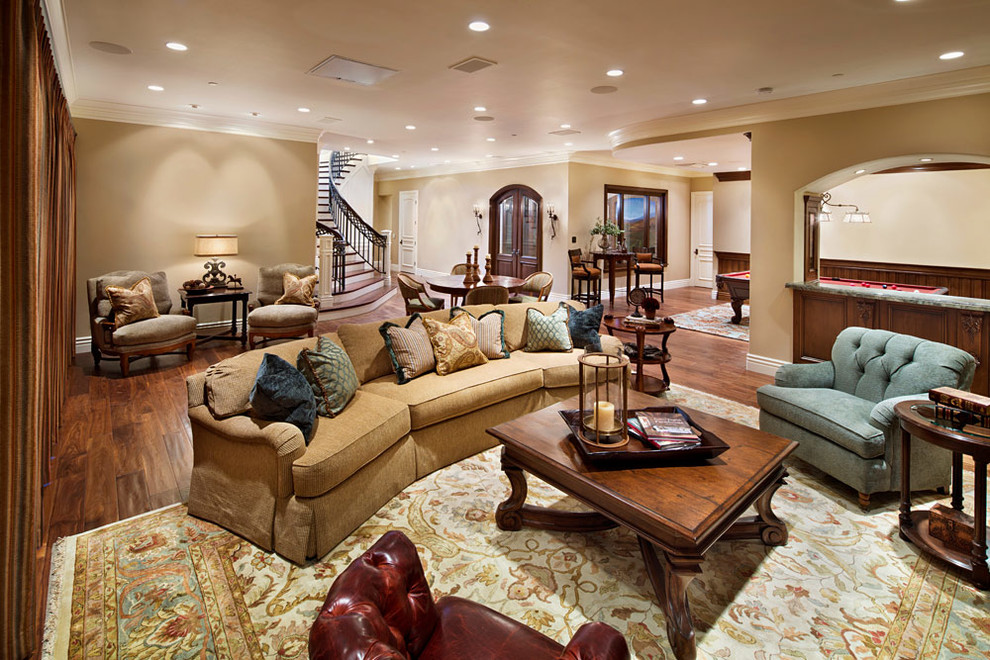 Photo of a large traditional family room in San Francisco with beige walls, brown floor and dark hardwood floors.