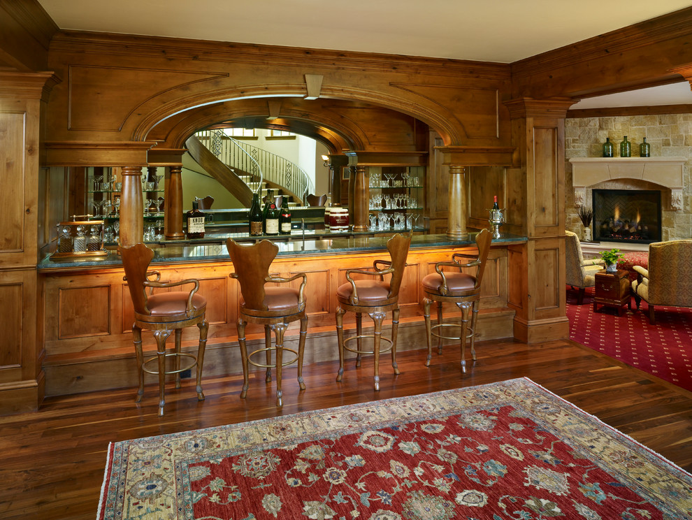 Photo of a large traditional home bar in Denver.