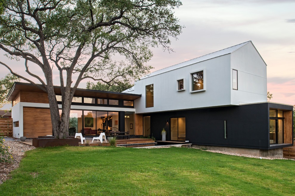 Photo of a contemporary two-storey exterior in Austin with a gable roof.