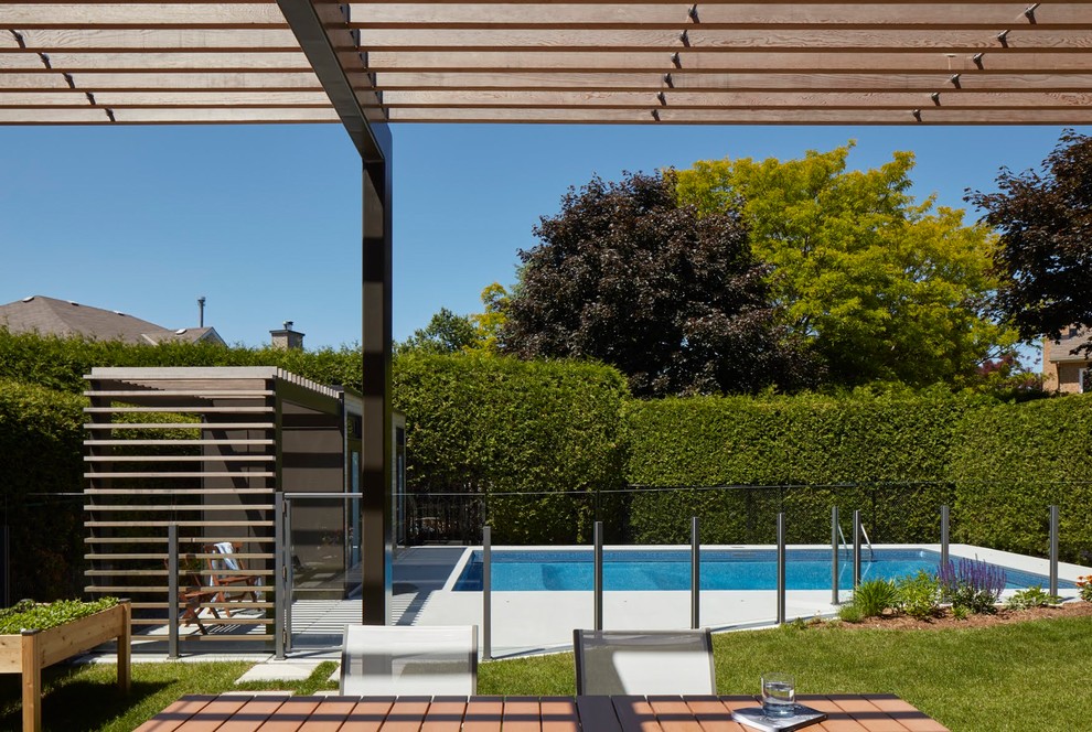 Inspiration for a large transitional backyard rectangular lap pool remodel in Ottawa