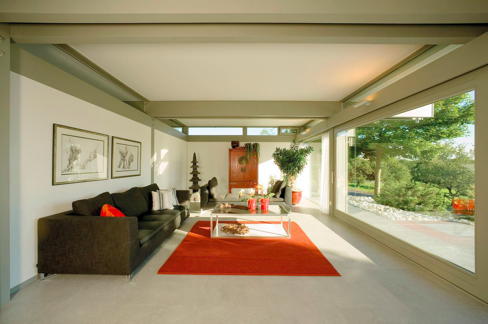 This is an example of a large asian formal enclosed living room in Hanover with white walls and no fireplace.