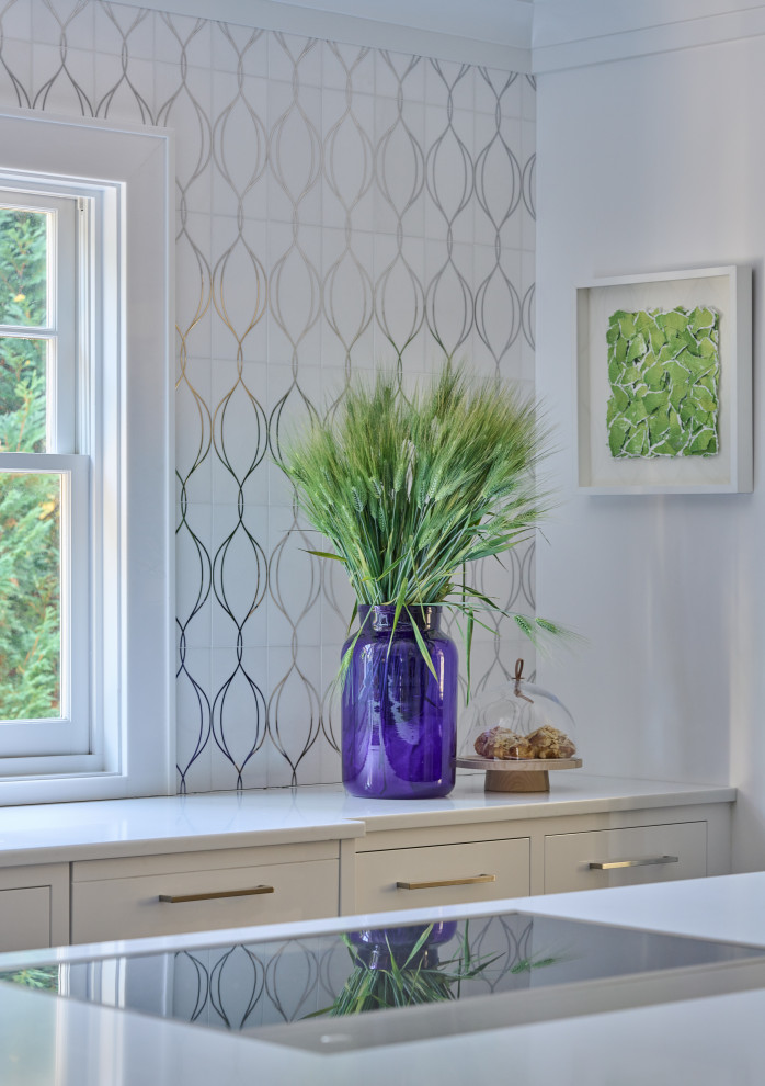 Example of a large transitional u-shaped dark wood floor and brown floor enclosed kitchen design in New York with an undermount sink, flat-panel cabinets, white cabinets, quartz countertops, white backsplash, mosaic tile backsplash, stainless steel appliances, an island and white countertops