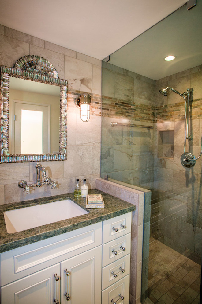Design ideas for a mid-sized beach style 3/4 bathroom in San Diego with an undermount sink, flat-panel cabinets, white cabinets, granite benchtops, an alcove shower, beige tile, white walls and stone tile.