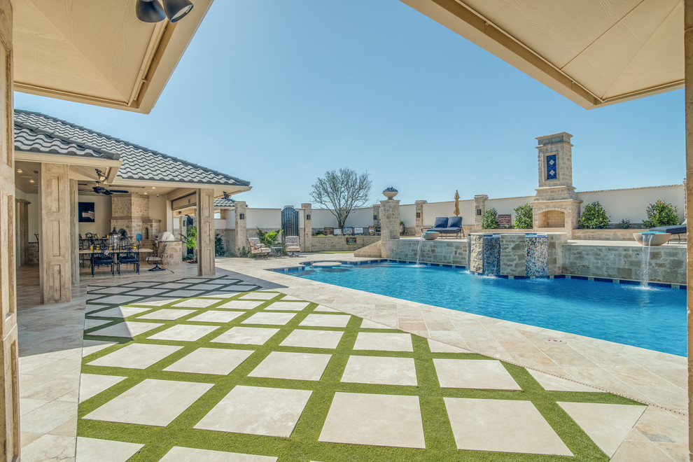 Design ideas for a large traditional backyard rectangular lap pool in Austin with a hot tub and concrete pavers.