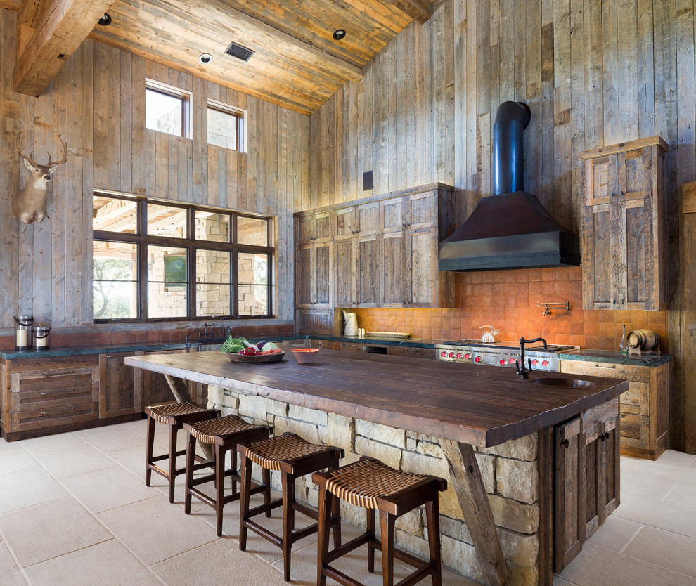 Design ideas for a country l-shaped open plan kitchen in Austin with shaker cabinets, medium wood cabinets, wood benchtops, orange splashback, terra-cotta splashback and stainless steel appliances.