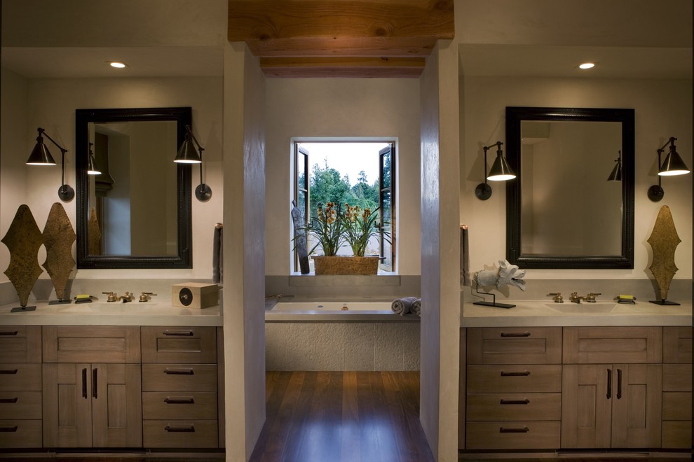 This is an example of a country bathroom in San Francisco with concrete benchtops.