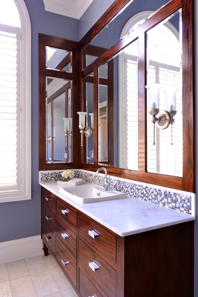 Inspiration for a large transitional bathroom in Dallas with a drop-in sink, flat-panel cabinets, dark wood cabinets, marble benchtops, a freestanding tub, a one-piece toilet, white tile, grey walls, marble floors and with a sauna.