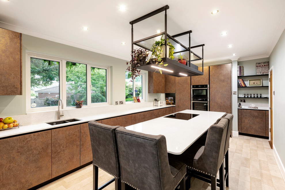Inspiration for a medium sized contemporary l-shaped kitchen/diner in Other with flat-panel cabinets, quartz worktops, black appliances, ceramic flooring, an island and white worktops.