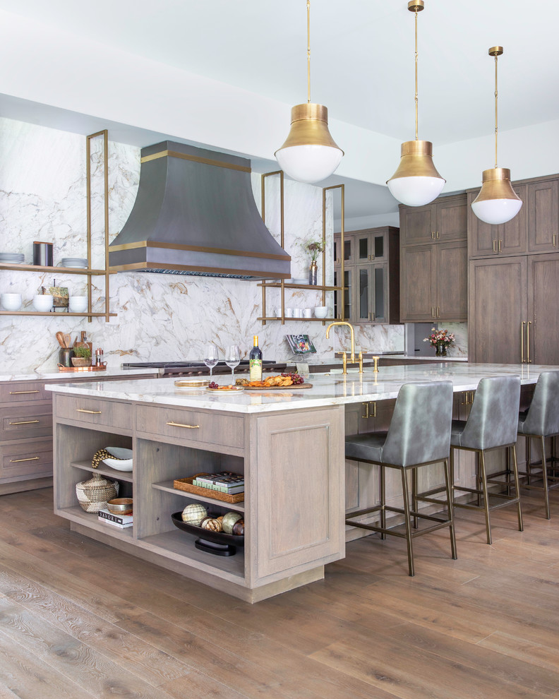 Inspiration for an expansive contemporary open plan kitchen in Houston with a farmhouse sink, recessed-panel cabinets, quartzite benchtops, multi-coloured splashback, stainless steel appliances, medium hardwood floors, with island, brown floor, multi-coloured benchtop and dark wood cabinets.