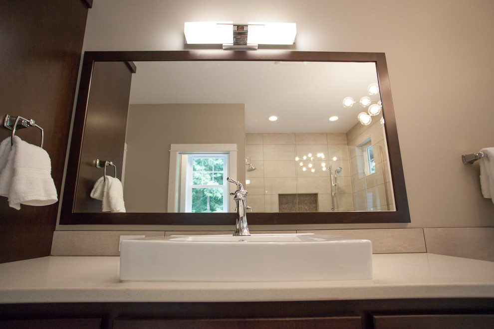 Mid-sized arts and crafts master bathroom in Seattle with shaker cabinets, dark wood cabinets, an undermount tub, a double shower, a two-piece toilet, gray tile, porcelain tile, grey walls, porcelain floors, a vessel sink and engineered quartz benchtops.