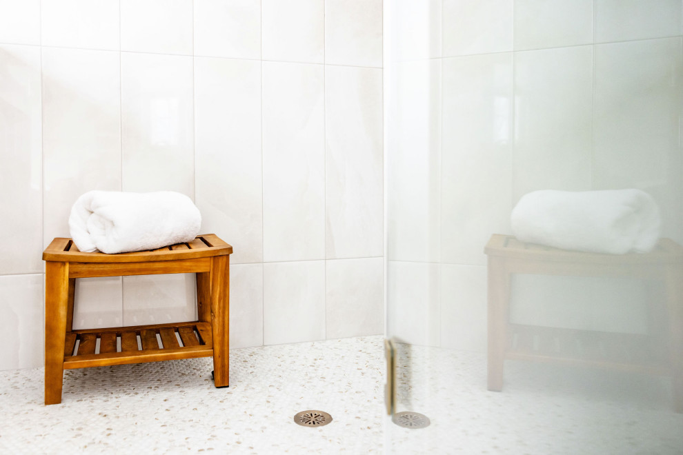 Huge transitional master double-sink, white floor and wall paneling freestanding bathtub photo in Boston with shaker cabinets, light wood cabinets, a freestanding vanity, quartzite countertops, white countertops, a hinged shower door, a two-piece toilet, white walls and an undermount sink