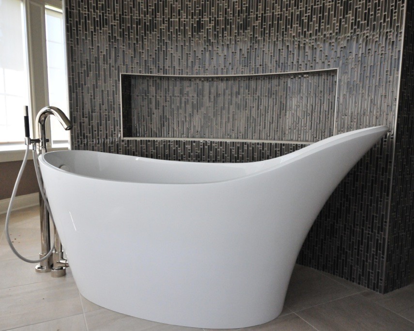 Example of a large transitional master limestone floor and white floor freestanding bathtub design with beige walls