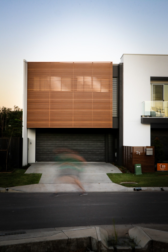 Design ideas for a modern house exterior in Sunshine Coast.