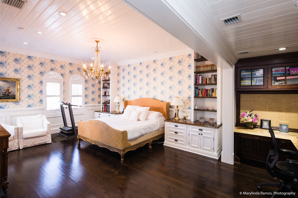 Photo of a beach style master bedroom in Boston with white walls, dark hardwood floors and brown floor.