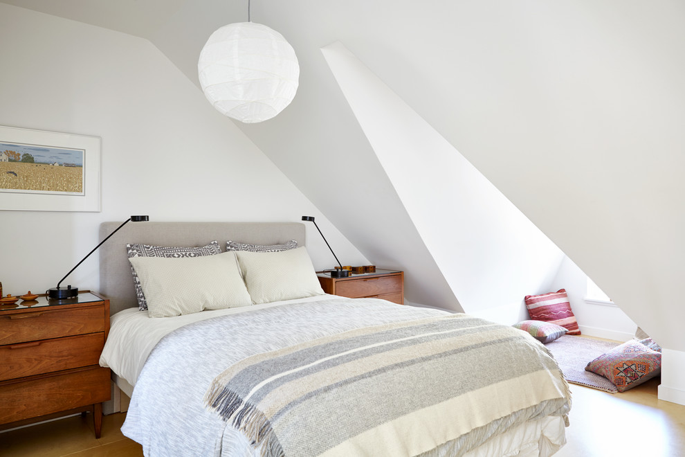 This is an example of a scandinavian bedroom in Toronto with white walls.