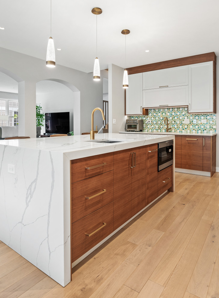 Inspiration for a large contemporary l-shaped light wood floor and yellow floor eat-in kitchen remodel in Chicago with an undermount sink, flat-panel cabinets, dark wood cabinets, quartz countertops, multicolored backsplash, stainless steel appliances, an island and white countertops