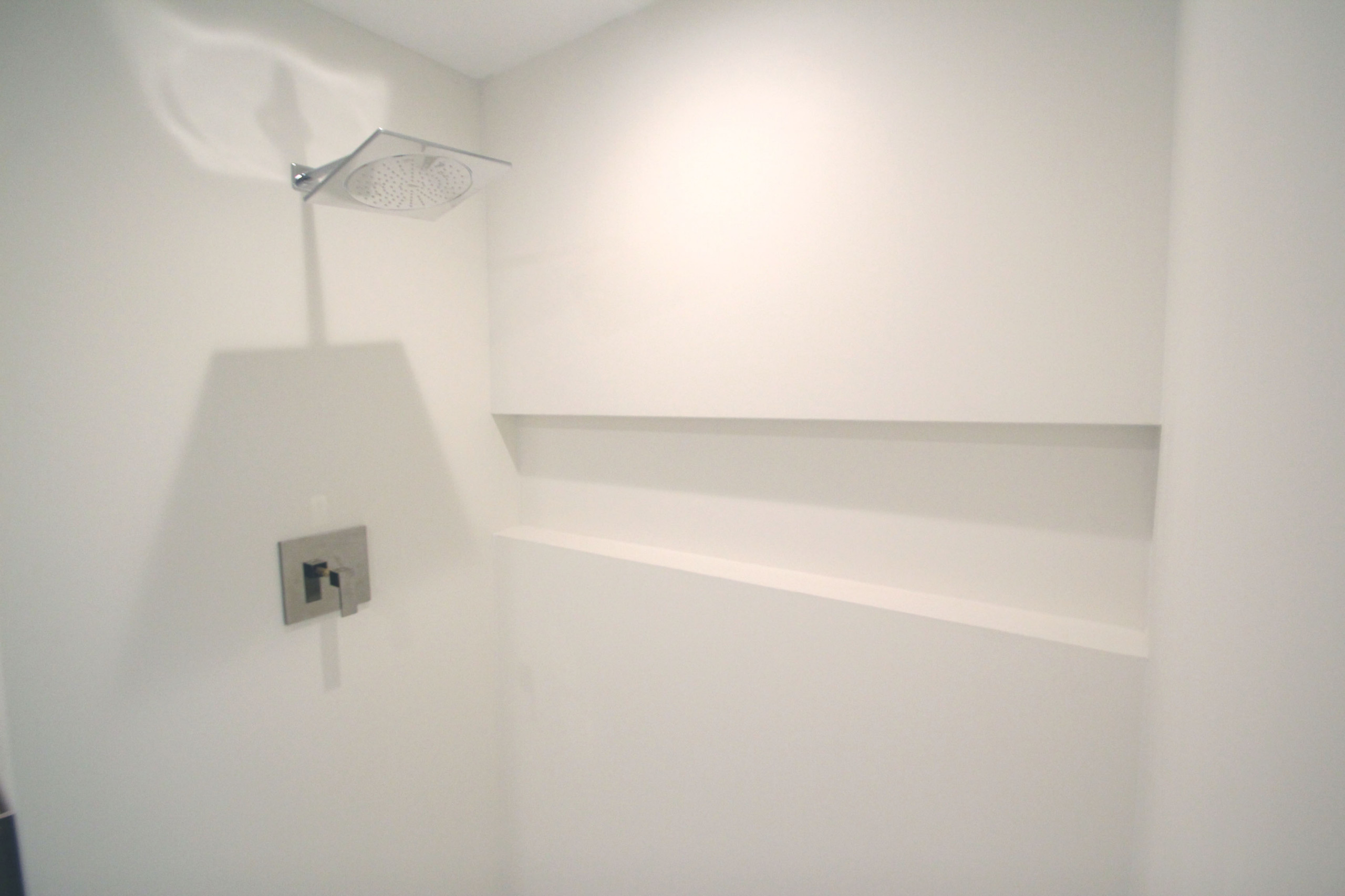 Minimalist White Bathroom - Neolith XL Porcelain tile slab/panel shower w niche