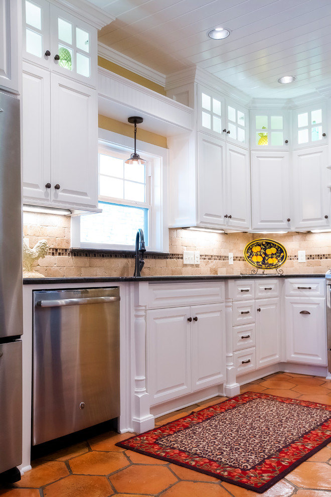 Large transitional terra-cotta tile kitchen photo in Austin with an undermount sink, raised-panel cabinets, white cabinets, granite countertops, multicolored backsplash, subway tile backsplash and stainless steel appliances