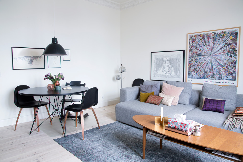 Inspiration for a scandinavian living room in Copenhagen with white walls and light hardwood floors.