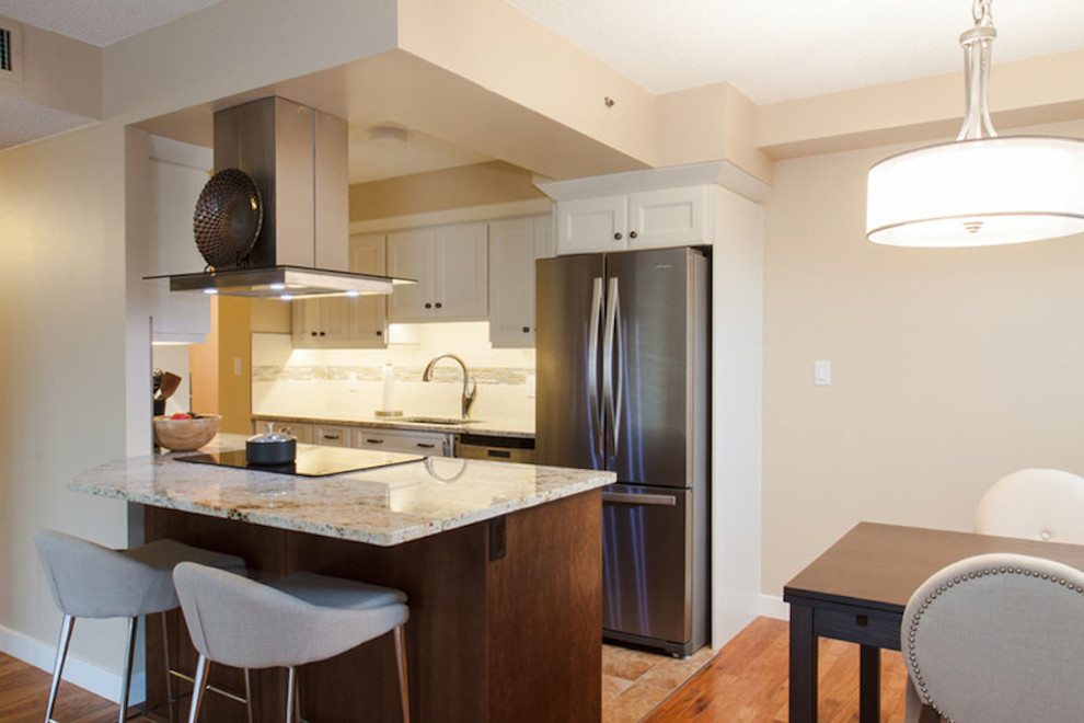 Example of a transitional kitchen design in Edmonton