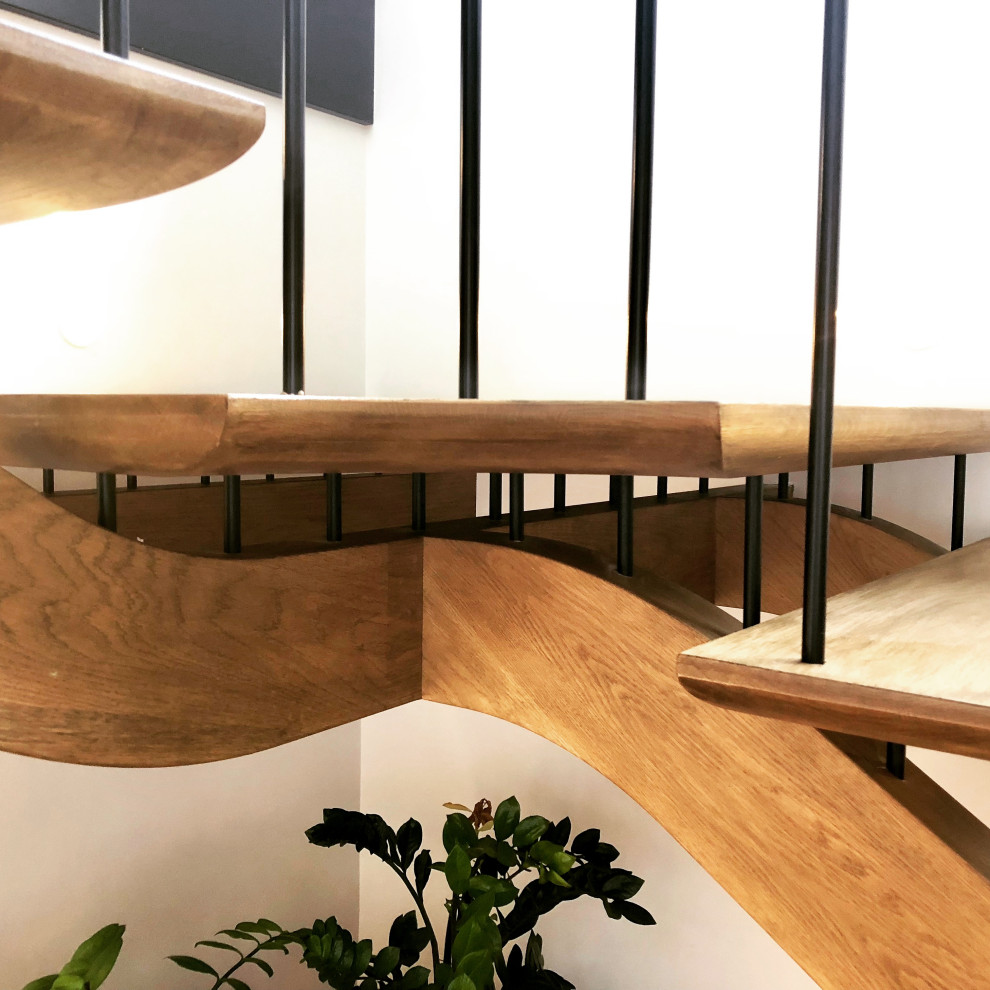 Design ideas for a large midcentury wood l-shaped staircase in Sydney with open risers and metal railing.