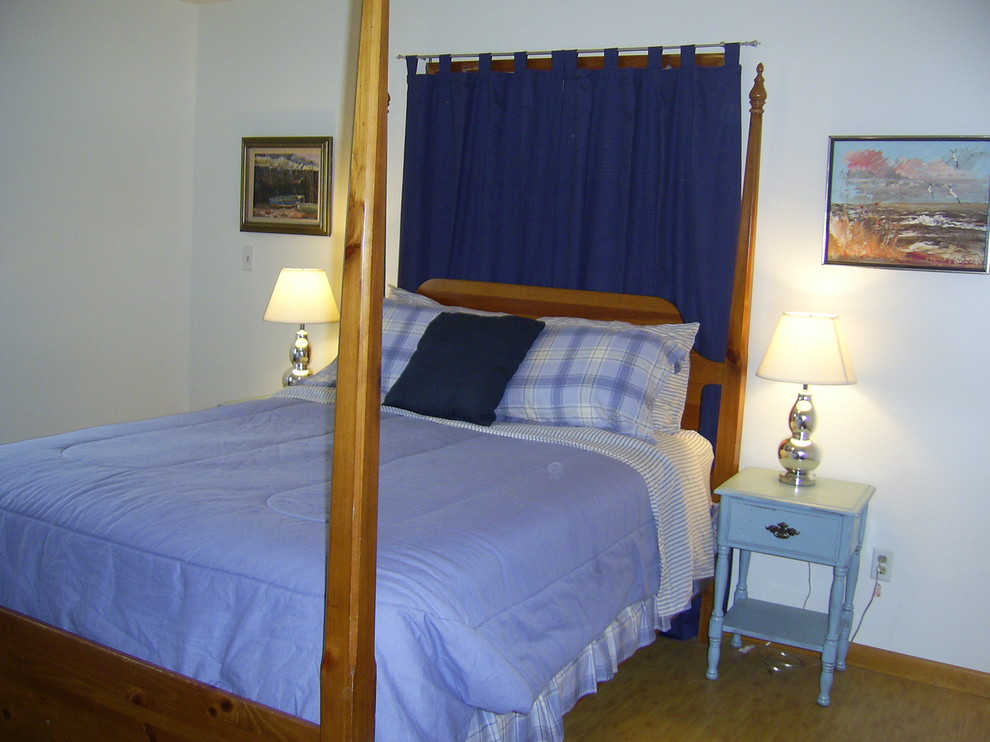 This is an example of a beach style bedroom in DC Metro.