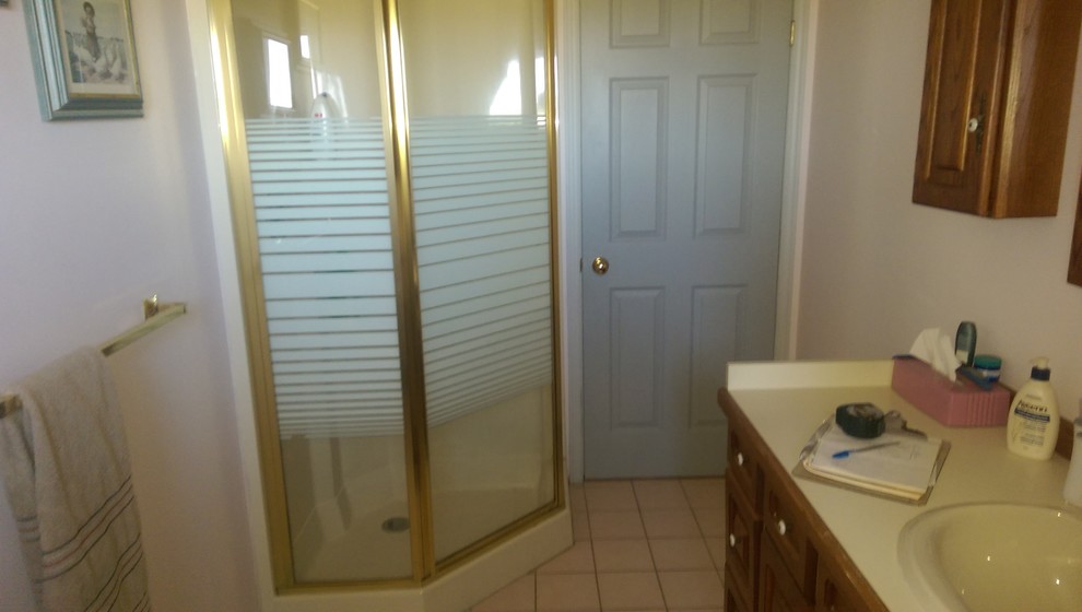 Alcove bathtub - mid-sized transitional master vinyl floor and multicolored floor alcove bathtub idea with recessed-panel cabinets, medium tone wood cabinets, a two-piece toilet, gray walls, laminate countertops and yellow countertops