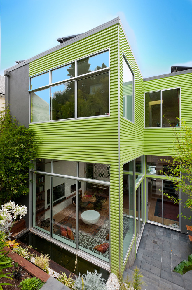 Inspiration for a contemporary one-storey green exterior in San Francisco with mixed siding.