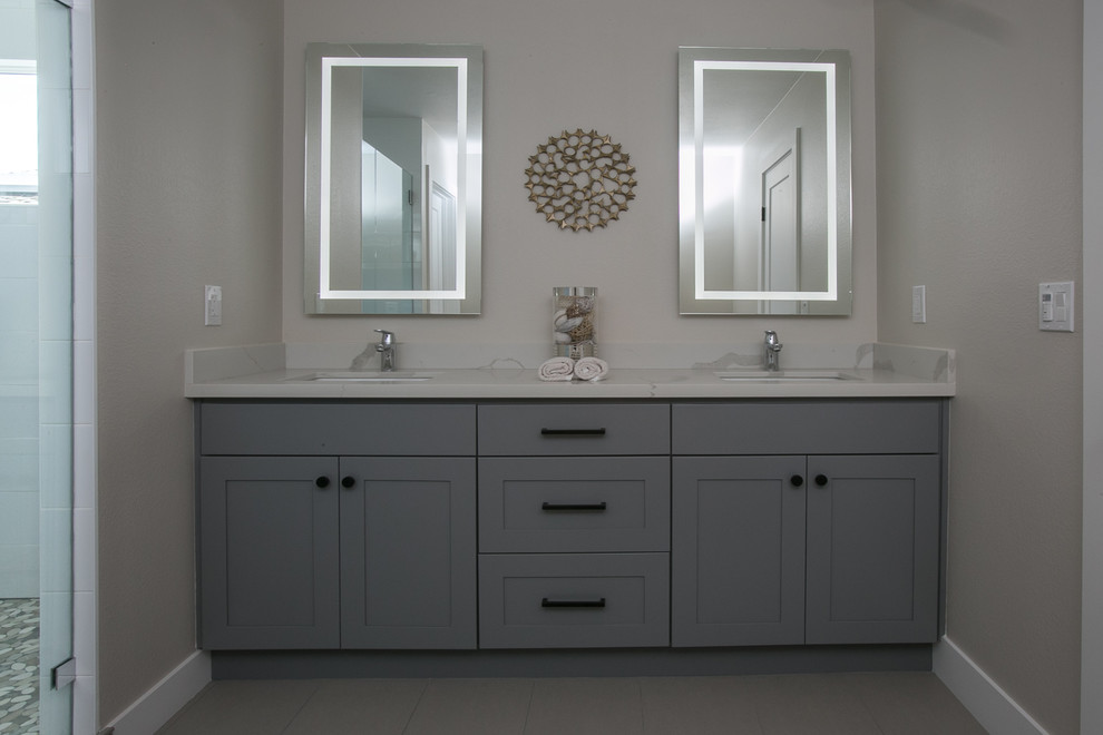 Inspiration for a large modern master bathroom in San Francisco with shaker cabinets, grey cabinets, an alcove shower, white tile, ceramic tile, quartzite benchtops, a hinged shower door, an undermount sink, cement tiles and grey floor.