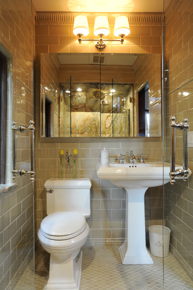 This is an example of a small traditional master bathroom in Columbus with a pedestal sink, an alcove shower, a two-piece toilet, beige tile, ceramic tile, beige walls and ceramic floors.