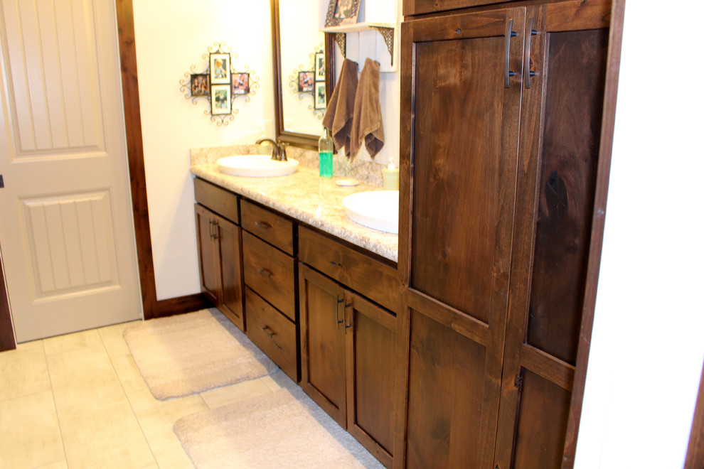 Bathroom - transitional bathroom idea with flat-panel cabinets, medium tone wood cabinets and laminate countertops