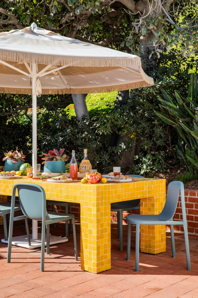 Inspiration for a coastal brick patio remodel in Orange County