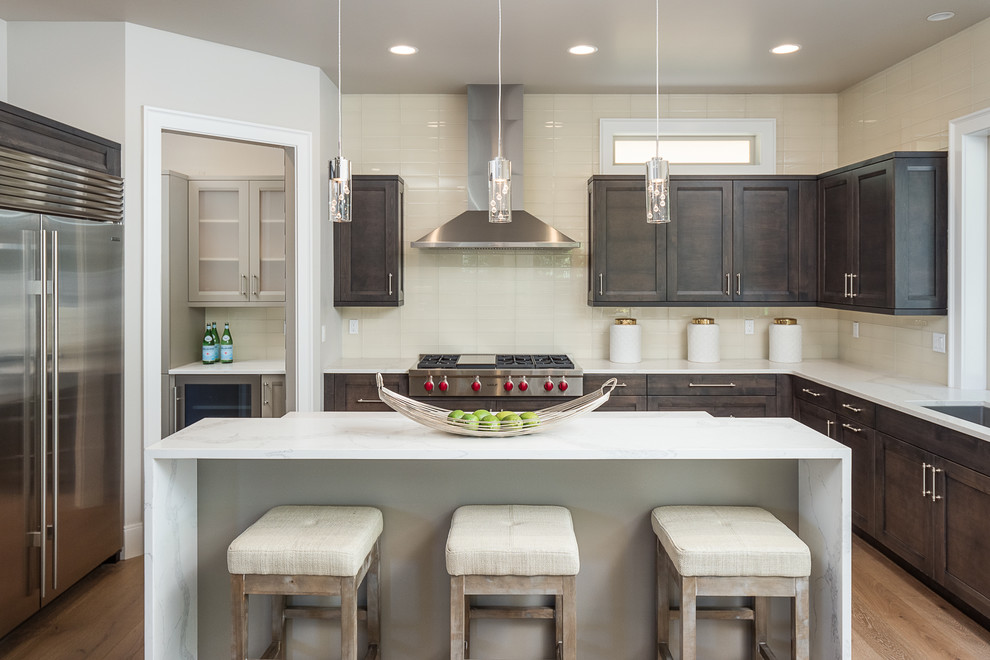Inspiration for a transitional kitchen in Seattle with shaker cabinets and dark wood cabinets.
