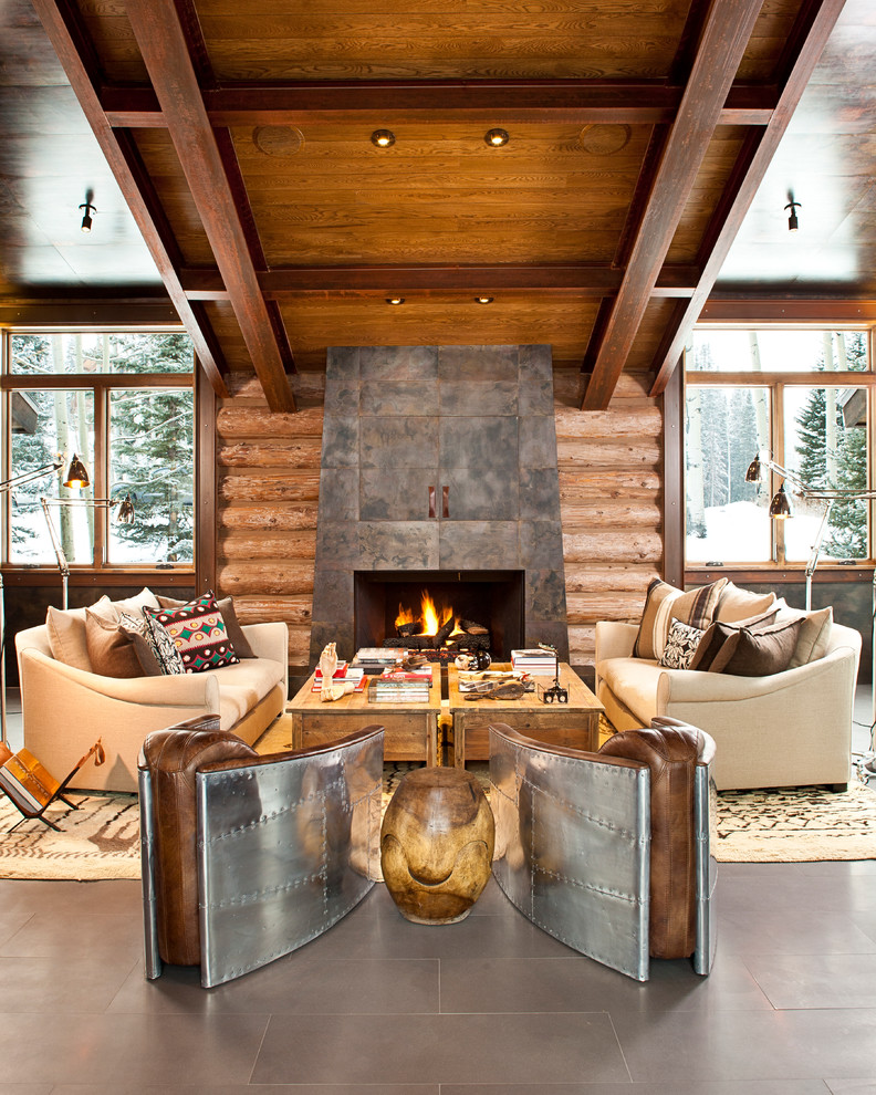 Contemporary living room in Denver with a concealed tv.