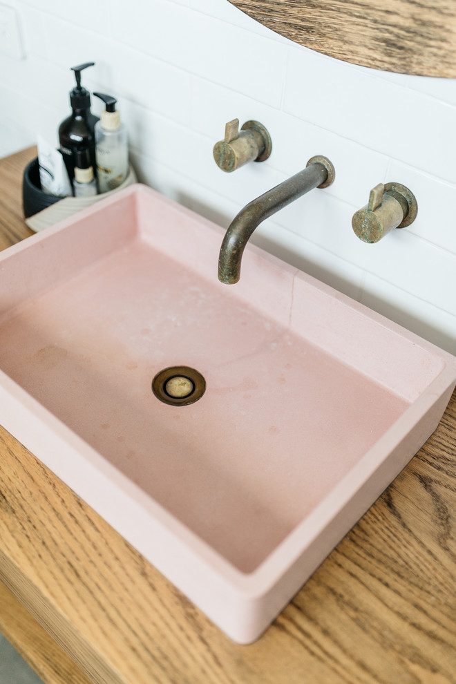 This is an example of a small beach style master bathroom in Central Coast with furniture-like cabinets, light wood cabinets, an open shower, white tile, ceramic tile, ceramic floors and grey floor.