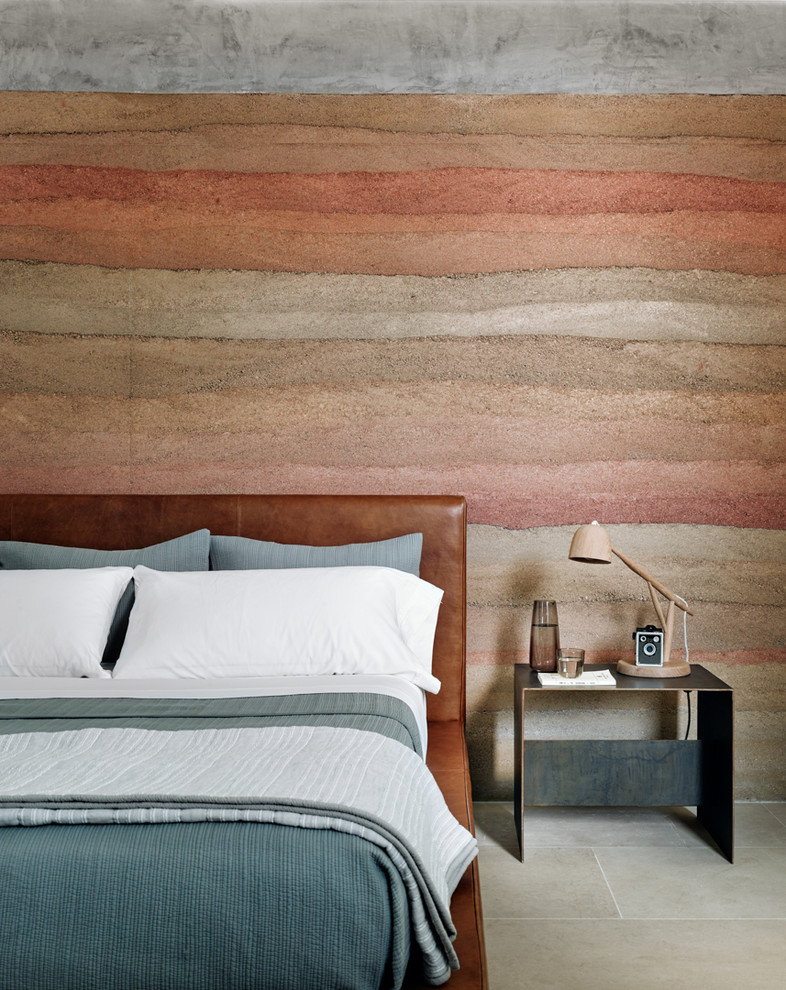 This is an example of a bedroom in Other with limestone floors, multi-coloured walls and grey floor.